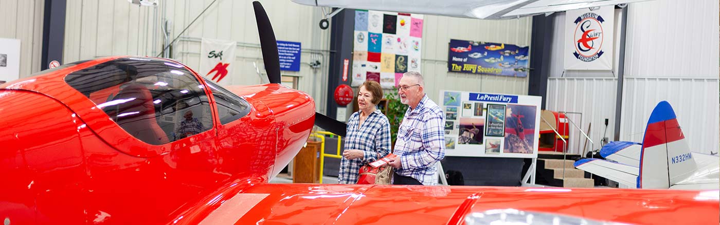 senior couple touring swift airplane museum