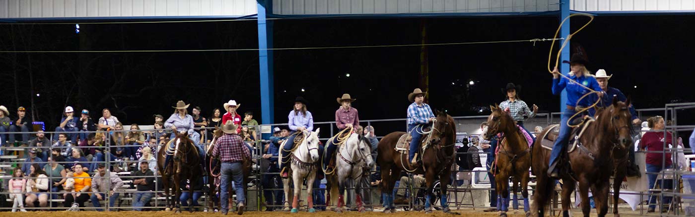 rodeo ring with horses and riders